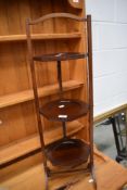 An early 20th Century mahogany folding cake stand