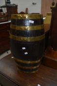 A period oak and brass bound barrel style stick stand