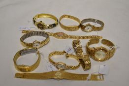 Ten ladies gold tone watches.
