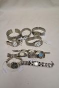Ten girls/ladies fashion watches, all having white straps.