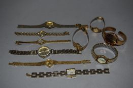 10 wrist watches all in gold tones.