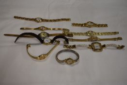 10 wrist watches all in gold tones.