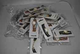 A selection of ladies fashion watches in various colours and designs, new in packaging.