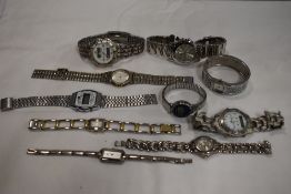 10 wrist watches all in silver tones.