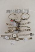 Ten ladies watches having silver tone straps.