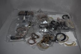 A box of approximately 78 bracelets for girls new in packaging