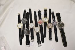 Ten mens watches all having black straps.