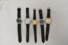 Five mens watches having black straps.