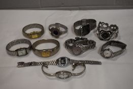 10 wrist watches all in silver tones.