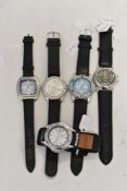 Five mens watches having black straps.