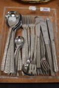 A selection of mid century Viners cutlery in the Bark pattern design