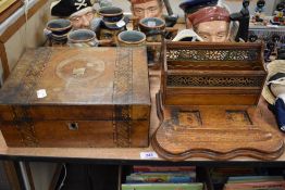 An antique sewing case with straw work design and an Edwardian desk tidy in oak with pierced brass