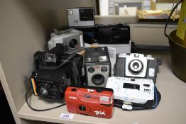 A selection of vintage photography cameras including Kodak, Halina, Polaroid, and Brownie