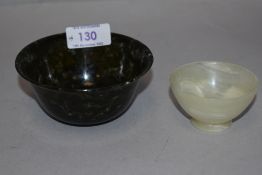 A 20th century spinach jade Chinese bowl having good colour with a similar white Jade bowl