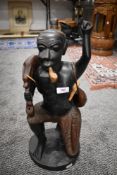 An African ethnic hard wood hand carved figure of a huntsman 50cm tall