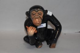 A vintage Sylvac figure of a seated monkey or chimpanzee