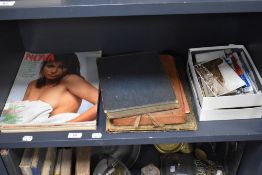 A selection of ephemera including postcards, Nova magazine and Will's cigarette card album