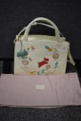 Two Radley handbags with dust covers, both having original swing tags still attached.