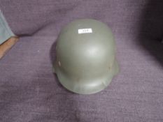 A German WW2 M42 Army Helmet with single decal to left hand side of eagle and swastika, size 59,