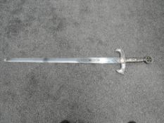 A reproduction medieval Knights Sword, blade length 94cm, overall length 120cm