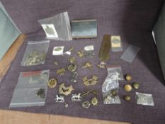 A Military collection including HMS Blake Main Burner Atomisers in wooden box, Cap Badges