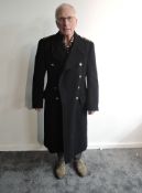 A Naval Great Coat, Captains Rank shoulder epaulettes, 11 large brass buttons and two small brass