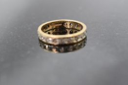 A 9ct gold full eternity ring having diamond chip decoration, size N & approx 2.8g