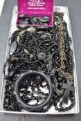 A selection of black morning jewellery including bog oak chain with cross pendant having mother of