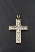 A 9ct gold cross pendant having eleven princess cut cubic zirconia, approx 7.1g