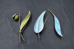 Two Norwegian silver and enamel brooches in the form of leaves and flower bud, and a Danish silver