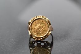 An American 1853 one dollar Liberty head coin (no mint mark) in a removable gold mount, probably