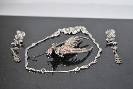 A small selection of marcasite jewellery including necklace, earrings and oversized fighting