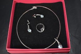 A 14ct white gold necklace with matching ring and earrings, all having aqua marine and diamond