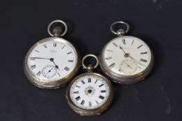 Two HM silver pocket watches and a small continental silver pocket watch, one bearing presentation