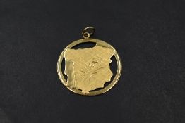 A yellow metal pendant in the form of Spain marked Espana, presumed gold, approx 1.7g