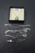 A small selection of silver jewellery including an enamelled egg pendant on a gold plated silver