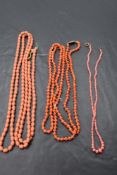 Three strings of carved coral beads of various lengths