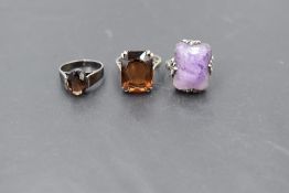 Three silver dress rings, two having oversized stones the other an oval stone, sizes N/O