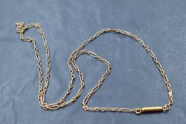 A yellow metal fancy link chain bearing plaque stamped 9C and having barrel clasp, approx 17' & 2.