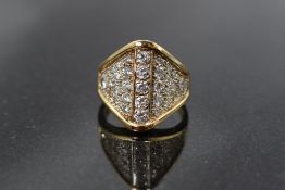 A multi set diamond ring having approximately 2ct of diamonds in a pave set ridged mount on a yellow