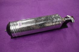 A 1960s Pyrene fire extinguisher and wall mount.