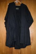 A vintage university gown marked Cambridge