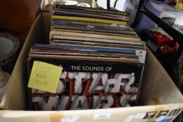 A box of approximately one hundred vintage vinyl albums of mixed genres