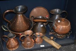 A fine selection of Victorian copper kitchen wares including a graduated set of six water jugs,