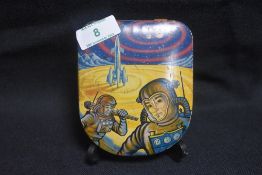 An early 20th century confectionary tin with lithograph print of Atomic space men