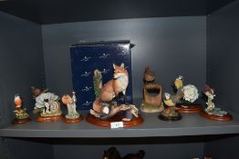 A selection of Border Fine Arts and similar figurines including Blue Tit and Hydrangea, and