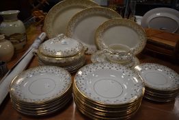 An early 20th century Pendant reg no. 749182 part dinner service in gilt on white ground