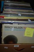 A box of approximately one hundred vintage vinyl albums of mixed genres