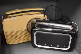 A Vintage Bush transistor radio in cream with a modern Bush radio set.