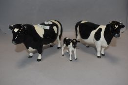 A family of modern Beswick Fresian cows and calf marked CH Claybury Leegwater and CH Coddington Hilt